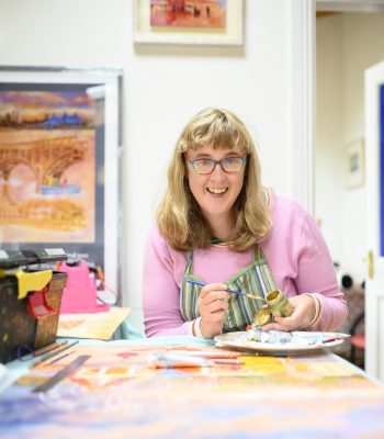 Artist Jennifer Cunningham working in her art studio