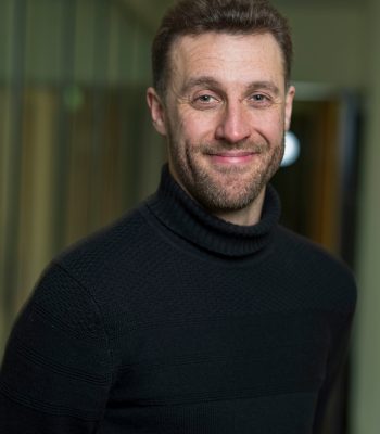 Filmmaker Ryan McKenna in an office headshot